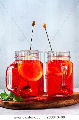 Chilled Karkade Tea With Lemon On A Wooden Stand On A Stone Table And Background. Antioxidants, Spas