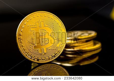 Bitcoin Blockchain  Btc Concept. Golden Bitcoin Coins As Symbol Of Electronic Virtual Money