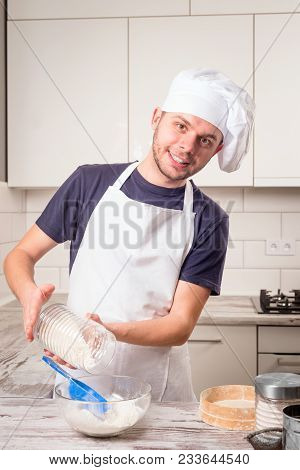Portrait Of A Male Chef Cook Praparation Pastry On A Kitchen