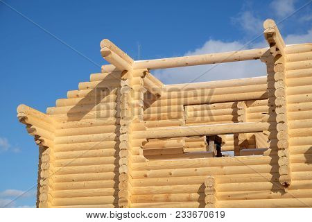 Big Rural House Construction From Sandy Brown Smooth Planed Heady Pine Logs On Bright Sunny Winter D