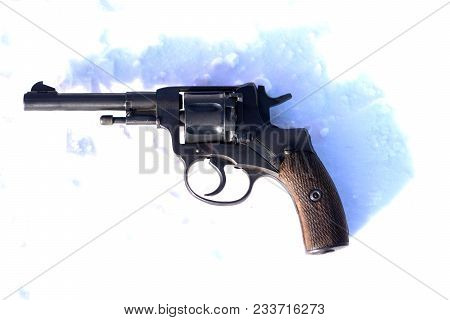 Mini Revolver With Wooden Grip On The Blacket Of Snow