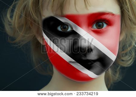 Portrait Of A Child With A Painted Flag Of Trinidad And Tobago On Her Face, Closeup.