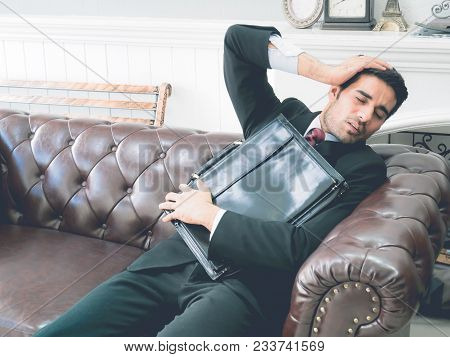 Feeling Sick And Tired The Young Man Is Still Depressed By The Tempest. And Closed His Eyes While Si