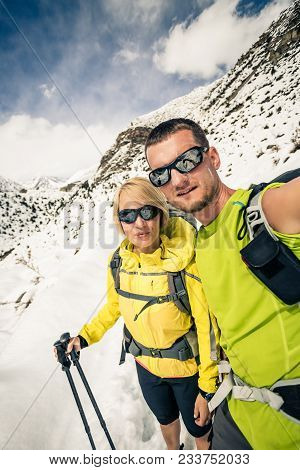 Couple Hikers Man And Woman Doing Selfie Portrait In Winter Mountains. Inspiration And Motivation In