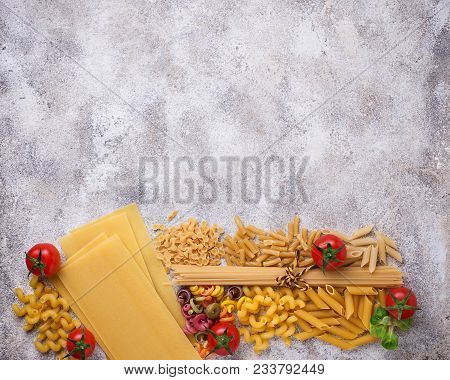 Various Type Of Pasta And Cherry Tomato. Top View