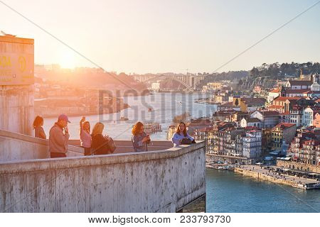 Porto, Portugal - February 20, 2018: Observation Deck. Tourists Taking Pictures And Admiring Of Old 