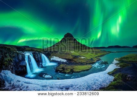 Northern Light, Aurora Borealis At Kirkjufell In Iceland. Kirkjufell Mountains In Winter.