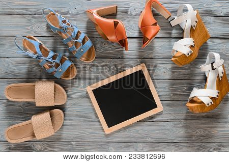 Set Of Womens Shoes (wedges, Heels And Flat Sandals) On Grey Wooden Background. Spring Summer Collec