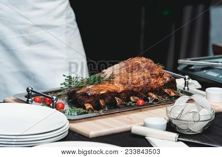 Homemade Bone-in Prime Rib Roast On Wooden Plank.