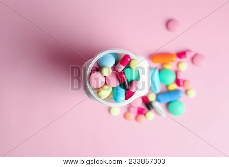 Bottle With Pills On Color Background