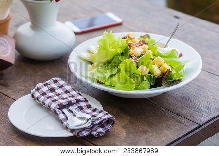 Fresh Vegetable Caesar Salad In White Bowl