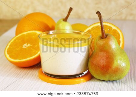 Food. Panna Cotta. Italian Milk Citrus Dessert Made Of Yogurt And Cream With Pear, Lemon And Orange.