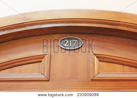 Wooden Door Frame With Room Number 217. Governmental, Administration, Municipal And Educational Offi
