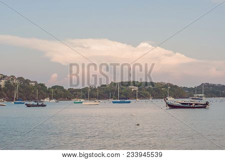 Sailboats In The Bay Against The Background Of A Large Pink Cloud.