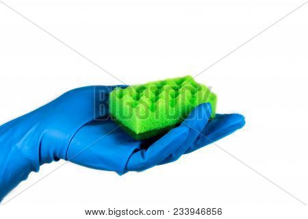 A Hand In The Rubber Blue Glove Holding A Green Cleaning Sponge On The White Isolated Background