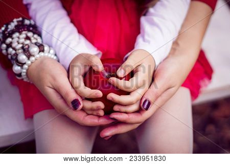 Mother And Kid Have Pinic Together In Autumn Park.