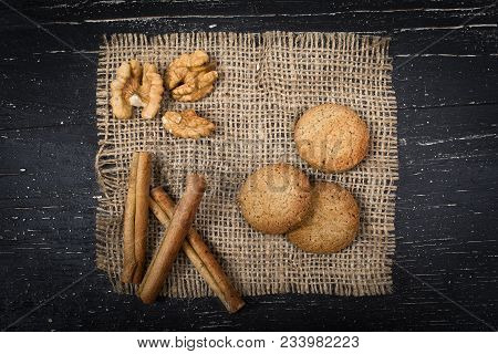 Oatmeal Cookies, Cinnamon And Peeled Walnut On Burlap