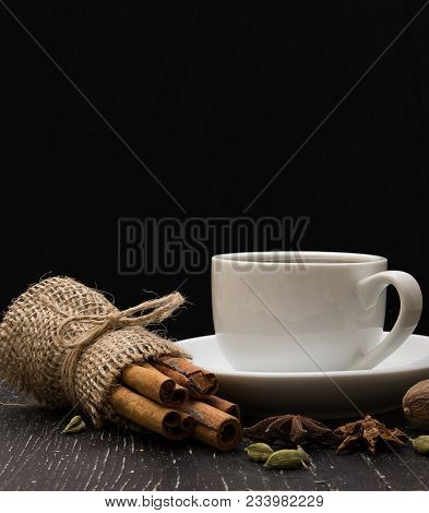 Coffee In A White Cup And Cinnamon
