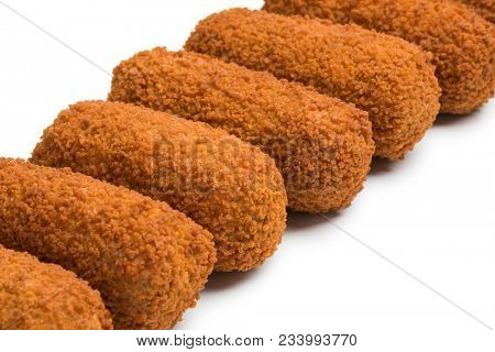 Row of deep fried Dutch kroketten  isolated on white background