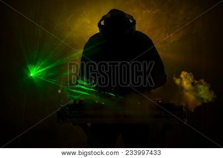 Dj Spinning, Mixing, And Scratching In A Night Club, Hands Of Dj Tweak Various Track Controls On Dj'