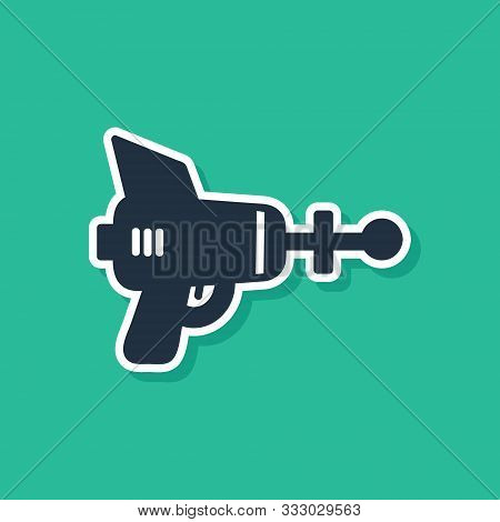 Blue Ray Gun Icon Isolated On Green Background. Laser Weapon. Space Blaster. Vector Illustration