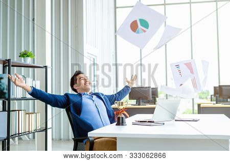 Happy Successful Of Asian Young Businessman For Threw Up The Business Plan In Document Paper Into Th