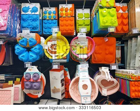 Kharkiv, Ukraine - June 21, 2019: Silicone Bakeware Different Colors And Forms Hang On The Shelf Of 