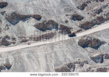 Chuquicamata, Chile - January 14: Big trucks and machinery at Chuquicamata, world's biggest open pit copper mine, Calama, Chile. Mining Operations at open pit Copper Mine near Calama, Northern Chile.