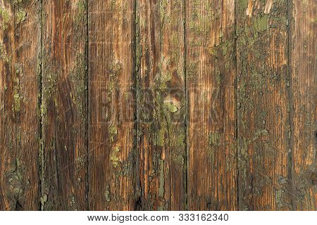 Dilapidated Wooden Wall With Parallel Vertical Panels. Texture Fragment