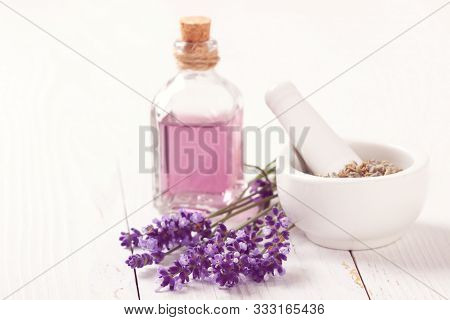Blend Of Essential Oils. Making Some Aroma Liquids, Perfume. Drops Falling From Pippet To Little Gla