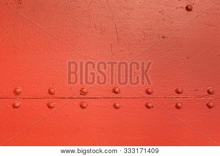 Red Vintage Industrial Texture With Symmetrical Horizontal Metal Rivets