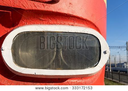 Headlight Of A Locomotive That Stands At The Railway Station