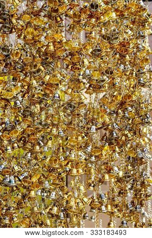 2019 July 28. Nakhon Thialand. An Anceint Small Wishing Golden Bell Hanging Around The Church Of Phr