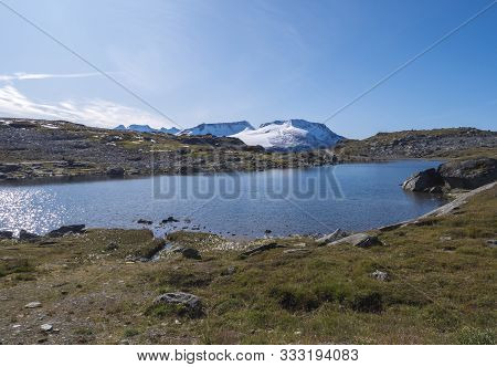 View From Sognefjellshytta With Blue Glacial Lake Fantesteinsvatnet Along Road 55 National Scenic Ro