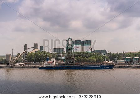 Long Tau River, Vietnam - March 12, 2019: Nhon Trach Area. Direct Look At Unloading Boat At Insee Ce