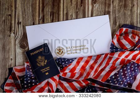 Usa Passport And Citizenship Naturalization Certificate Of Us Flag Over Wooden Background