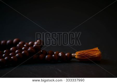 Wooden Japamala, Rosary Hindu, Dark Background, Orange And Brown