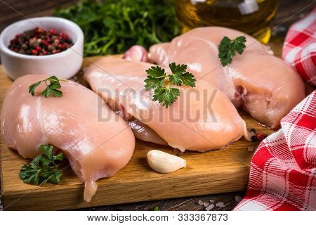 Chicken Fillet With Ingredients For Cooking On Wooden Kitchen Table.