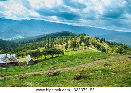 Countryside Road Through Grassy Hill. Rural Transportation Concept. Lovely Summer Landscape In Carpa