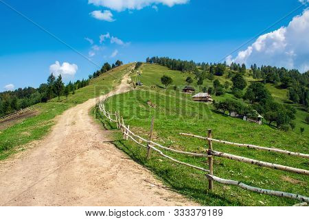Countryside Road Through Grassy Hill. Rural Transportation Concept. Lovely Summer Landscape In Carpa