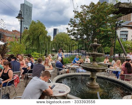 Manchester, United Kingdom - August 3, 2019: People Drink At A Pub In Castlefield District In Manche