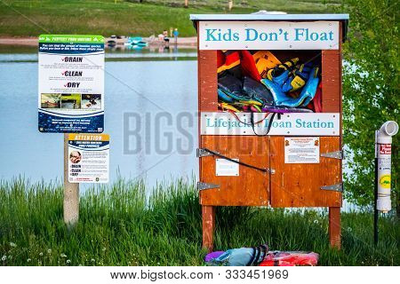 Buffalo, Wy, Usa - June 3, 2019: A Life Jacket Loan Station Caution Signboard