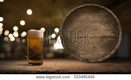 Old Wooden Barrel On A Brown Background