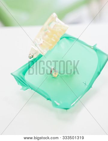 An Artificial Jaw As A Good Example For A Dentist. Layout Of Human Teeth With A Cofferdam.