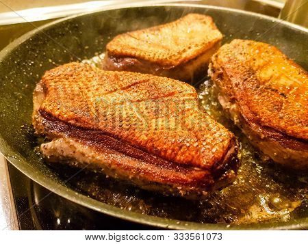 Fried Duck Breast With Red  Cabbage And Croquettes