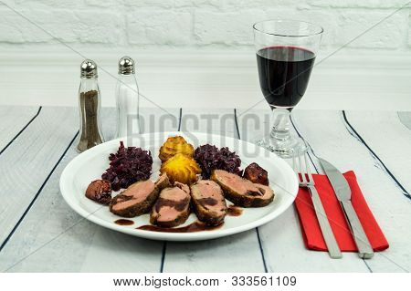 Fried Duck Breast With Red  Cabbage And Croquettes