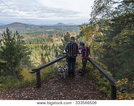 Czech Republic, Sloup V Cechach, October 27, 2019: Men And Woman Couple With Two Dogs At View On Vil