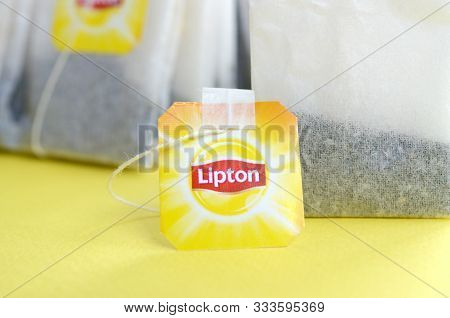 Lipton Yellow Label Black Tea Bags On Pastel Yellow Surface Close Up. Lipton Is A World Famous Brand