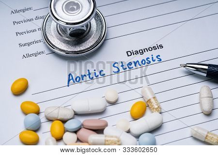 Aortic Stenosis Diagnosis Written On A Form With Stethoscope, Pen And Pills