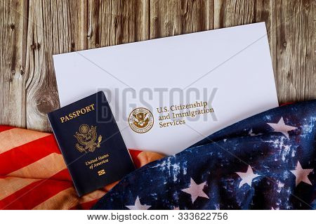 Usa Passport And Citizenship Naturalization Certificate Of Us Flag Over Wooden Background